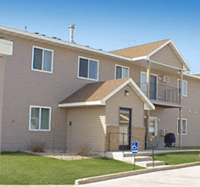 Detroit Lakes apartment for rent - Apartment building with a blue handicap sign in front.