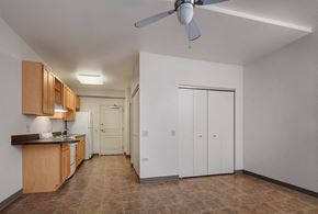 Chicago apartment for rent - a room with a kitchen and a ceiling fan