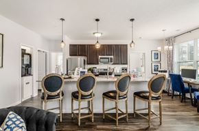Columbus apartment for rent - A kitchen with a table and chairs in front of it.