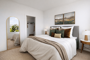 Columbus apartment for rent - A bedroom with a large bed and a painting on the wall.