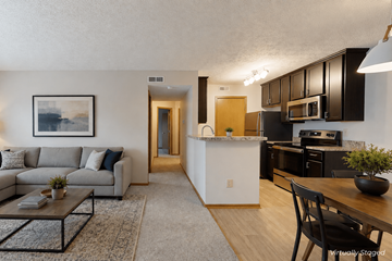 Columbus apartment for rent - A living room with a grey couch and a coffee table.