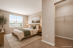 Worthington apartment for rent - A bedroom with a large bed and a painting on the wall.