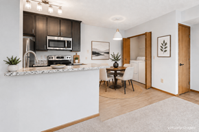 Columbus apartment for rent - A kitchen with a white counter and brown cabinets.