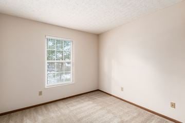 Powell apartment for rent - a bedroom with white walls and a window