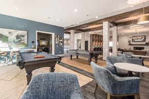 Upper Arlington apartment for rent - a game room with two pool tables and chairs