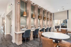 Upper Arlington apartment for rent - A dining room with a long table surrounded by chairs.