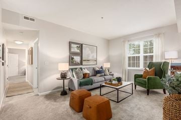 Westerville apartment for rent - a living room with a couch and a chair and a window