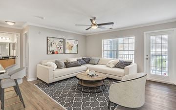 Jacksonville apartment for rent - A living room with a white couch and a coffee table.