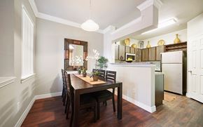 Conroe apartment for rent - A kitchen with a table and chairs in the middle of the room.