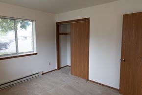Cedar Grove apartment for rent - a bedroom with a door to a closet and a window