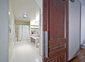 Seattle apartment for rent - a bathroom with a shower and a wooden door