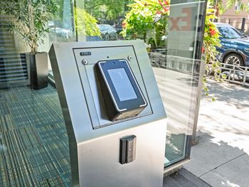 An iphone on a parking meter on a city street