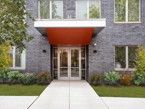 Chicago apartment for rent - the entrance to a building with a red awning over the door