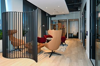 A lobby with a seating area and a gate