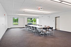 Chicago apartment for rent - a conference room with a long table and chairs