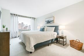 Chicago apartment for rent - Comfortable Bedroom With Large Window at Elm Street Plaza, Chicago, IL