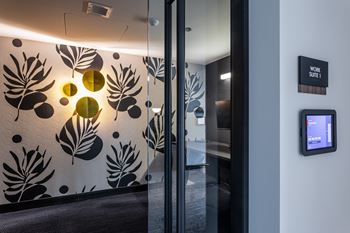A wall with a leaf pattern and circles on it.