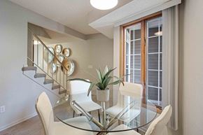Woodbury townhouse for rent - a dining room with a glass table and chairs at Seasons Villas, Woodbury Minnesota