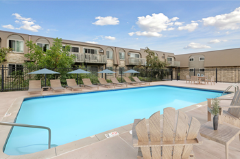 Swimming pool with lounge chairs and umbrellas