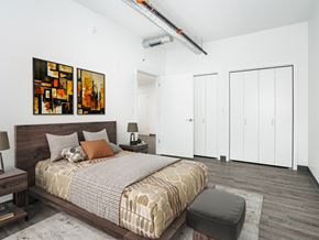 Chicago apartment for rent - a bedroom with a bed and two paintings on the wall