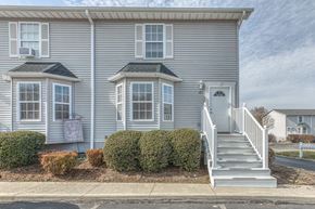 Jonesborough apartment for rent - A two-story house with a grey exterior and a white door.