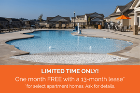 Arden townhouse for rent - A pool surrounded by apartment buildings with a sign offering a free month with a lease.