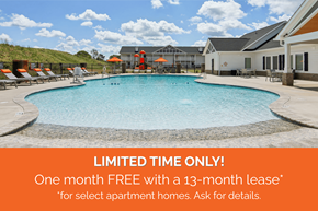 Boiling Springs townhouse for rent - A pool surrounded by sun loungers and umbrellas with a sign offering a free month with a 13-month lease for select apartment homes.
