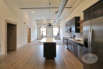 Johnson City apartment for rent - a kitchen and living room with a table in the middle of the floor