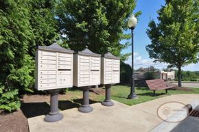 Johnson City townhouse for rent - A row of mailboxes next to a bench.
