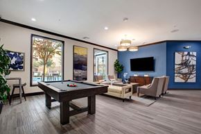 Sacramento apartment for rent - A pool table is in the middle of this room.