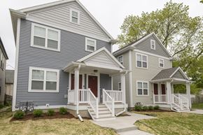 Milwaukee triplex for rent - A two-story house with a front porch.