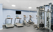 Arlington apartment for rent - A gym with treadmills, elliptical machines, and other exercise equipment.