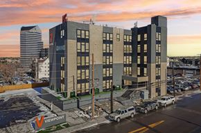 Denver apartment for rent - A parking lot with cars and a building with a Viewpoint sign.