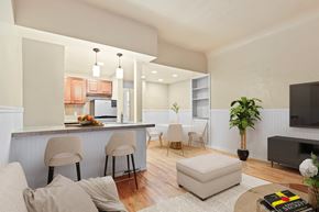 Denver apartment for rent - a living room with a kitchen and an open floor plan