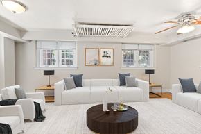 Denver apartment for rent - a living room with white furniture and a white rug