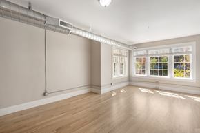Denver apartment for rent - A room with a window and a white pipe on the wall.