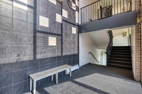 Denver apartment for rent - a bench in front of a building with stairs