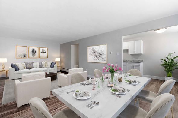 Denver apartment for rent - a living room with a white table and chairs