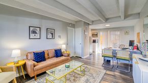 Denver apartment for rent - a living room with a couch and a glass table