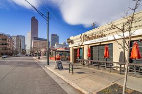 Denver apartment for rent - A street view of a city with a building named Christi's Food Service.