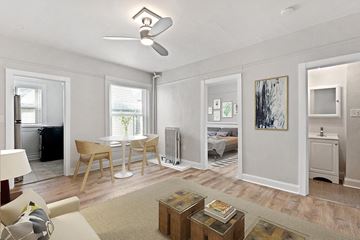 Denver apartment for rent - a living room and dining room with a couch and a table