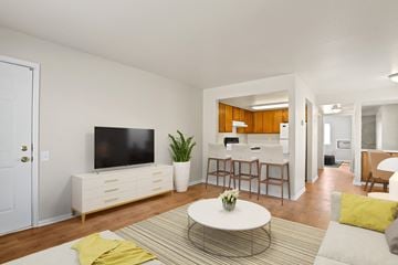 Denver apartment for rent - a living room with a couch and a table and a television