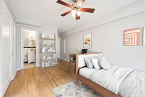 Denver apartment for rent - a bedroom with a bed and a ceiling fan