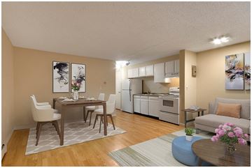 Denver apartment for rent - a living room and kitchen with a table and chairs