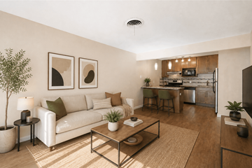 Denver apartment for rent - A living room with a white couch and a coffee table.