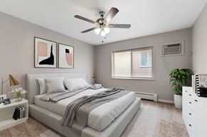 Denver apartment for rent - a bedroom with a bed and a ceiling fan