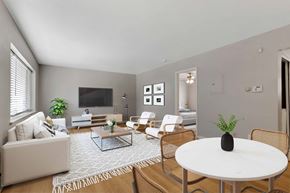 Denver apartment for rent - a living room with white furniture and a white table