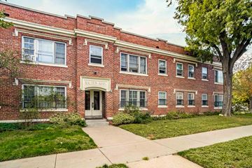 Denver apartment for rent - A red brick building with the words "Mallory Hall" on the front.