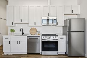 Denver apartment for rent - A kitchen with white cabinets and stainless steel appliances.