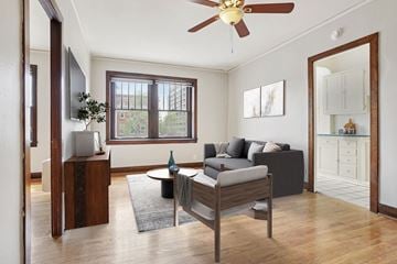Denver apartment for rent - A living room with a grey couch and a wooden coffee table.
